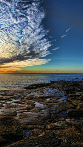 Rocky shore water clouds rocks - free sunset wallpaper for mobile