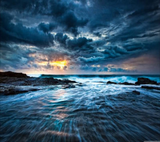 Sunset ocean waves clouds city - free beach wallpaper for tablet