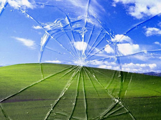 Cracked window green field blue 3 - a green field free wallpaper for desktop