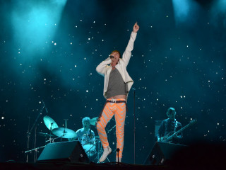 Man orange pants white jacket - a white jacket free wallpaper