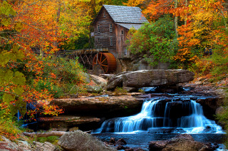 Waterfall forest wooden building stream - a waterfall in a forest free wallpaper