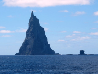 Large rock formation ocean boat 2 - carl critchlow free wallpaper for desktop