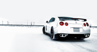 White sports car snowy road 2 - a white sports car free wallpaper for desktop