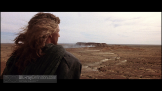 Woman looking out barren landscape - movie scene free wallpaper