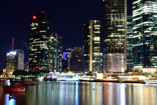 City skyline night boat water 6 - the water and a boat in the foreground free wallpaper