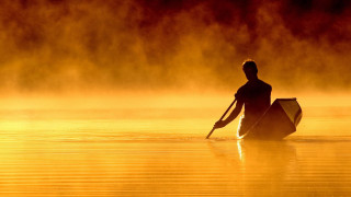 Man paddling canoe lake sunset - a red sky free wallpaper