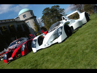 Cars parked lush green field - a group of cars free wallpaper