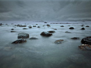 Rocks beach cloudy sky background 2 - top of a beach under a cloudy sky free wallpaper