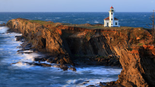 Lighthouse cliff ocean waves crashing - the ocean free wallpaper