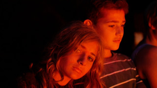 Couple looking cake candles middle - a cake free wallpaper