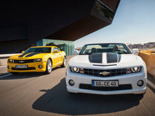 Two cars driving road sunny - a sky background and a building free wallpaper
