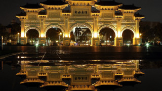 Clock tower night building reflection - free architecture wallpaper for desktop