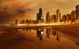 City skyline water night lights - a body of water in front free wallpaper for desktop