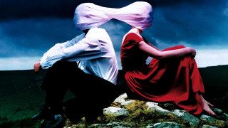 Man woman rock cloudy sky - a dark cloud free wallpaper for desktop