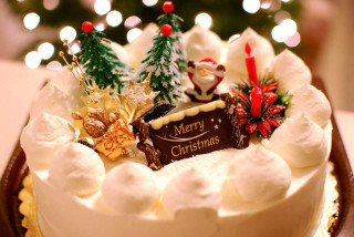 Merry christmas cake decorations christmas - a christmas tree in the background free wallpaper