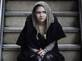 Woman sitting stairs black outfit - a set of stairs free wallpaper