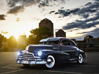 Classic car sunset parking lot - a classic car free wallpaper
