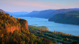 Lake mountains trees boat sunset - a scenic view of a lake free wallpaper
