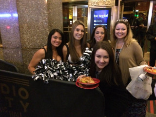 Women holding pizzas posing picture - a group of women free wallpaper