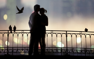 Couple kissing bridge birds flying - free valentines wallpaper for desktop