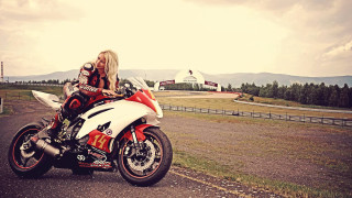 Woman motorcycle road field fence - a plane in the background free wallpaper for desktop