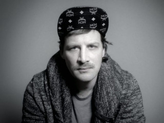 Man hat sitting serious looking - christian w. staudinger free wallpaper for desktop