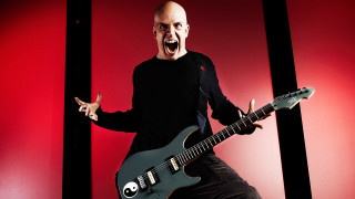 Man black shirt black guitar - a black guitar free wallpaper