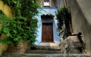 Open door narrow street steps - step free wallpaper
