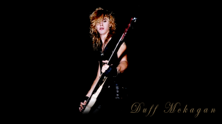 Woman guitar pose black background - a guitar free wallpaper