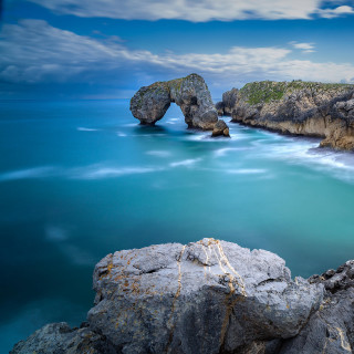 Rocky shore formation ocean sunset - free landscape wallpaper for tablet