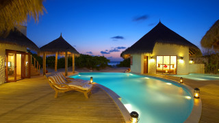 Resort pool ocean night lights - the deck free wallpaper