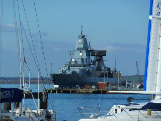 Large ship docked at dock - filter free wallpaper