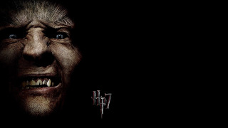 Creepy man dark background teeth - a creepy look free wallpaper