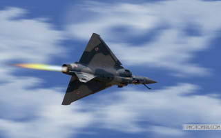 Jet flying cloudy blue sky 3 - a cloudy blue sky free wallpaper