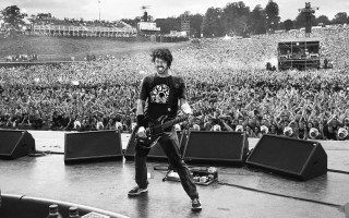 Man stage guitar crowd performance - a guitar in front free wallpaper