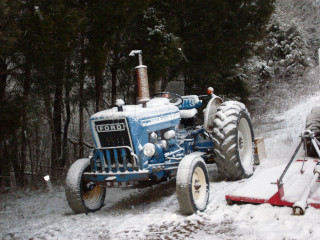 Tractor parked snow man snow - a tractor free wallpaper