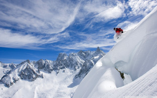 Person skis jumping snowy mountain - fabien charuau free wallpaper