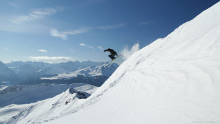 Snowboarder jumping snowy hill mountains - a snowy hill free wallpaper