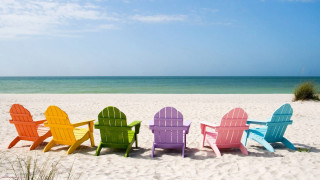 Colorful chairs sandy beach ocean 5 - a green grass free wallpaper