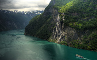 Boat water mountain cliff waterfall - a boat free wallpaper for desktop