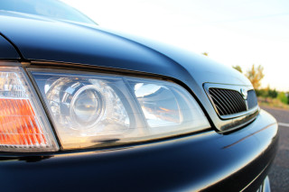 Car headlight closeup road sky - a sky background and trees free wallpaper for desktop