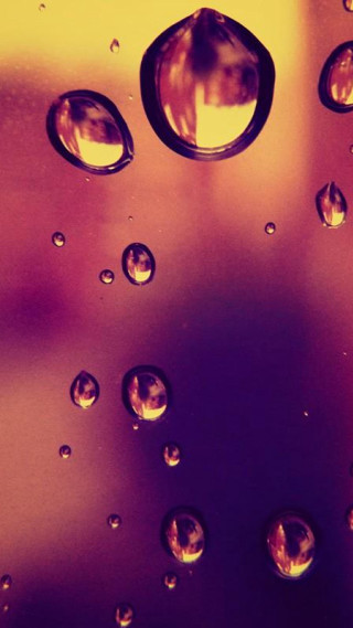 Water droplets glass abstract macro - a yellow background free wallpaper