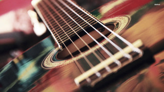 Guitar neck strings closeup blurry - a close up of a guitar neck free wallpaper