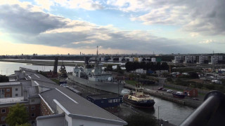 Large boat docked city harbor - a few building free wallpaper