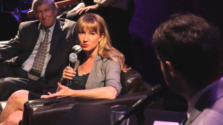 Woman chair microphone man standing - her hand and a man free wallpaper