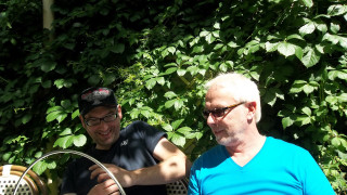 Two men bench bush green - a bench in front free wallpaper