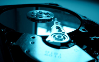 Hard drive closeup blue background - f 8 aperture free wallpaper