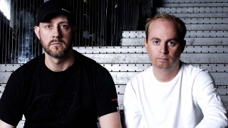 Two men sitting wall clock - a clock free wallpaper