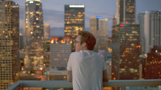 Man balcony city night skyscrapers 2 - the background and a city skyline free wallpaper