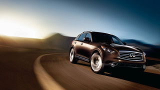 Brown car driving mountain range - a brown car free wallpaper for desktop